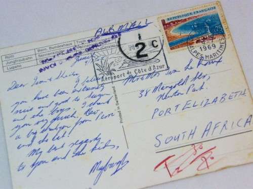 Post card France to South Africa with Swiss scenes and half cent tax mark