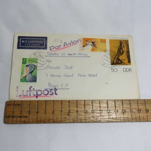 Airmail cover from Schmolln, DDR to Paarl, South Africa with airmail tag, Par Avion ink cancel