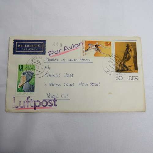 Airmail cover from Schmolln, DDR to Paarl, South Africa with airmail tag, Par Avion ink cancel