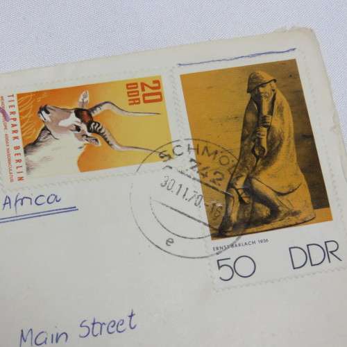 Airmail cover from Schmolln, DDR to Paarl, South Africa with airmail tag, Par Avion ink cancel