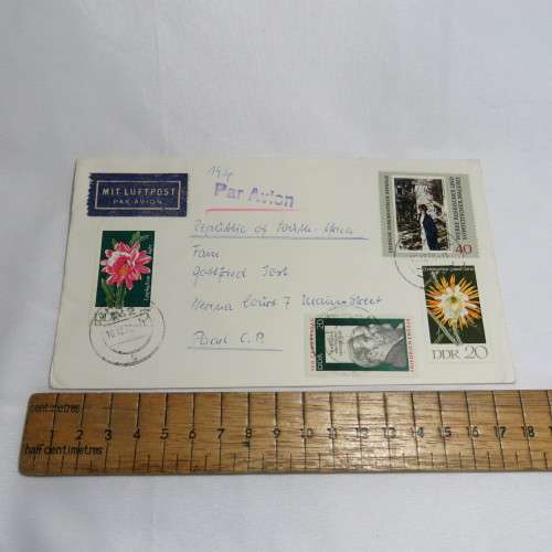 Airmail cover from Schmolln, DDR to Paarl, South Africa with airmail tag and Par Avion ink cancel