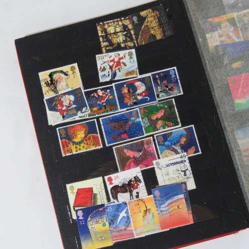 Lot of over 230 British and other stamps in album