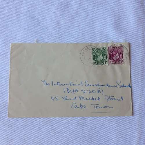 Postal cover from Asaba, Nigeria to Cape Town, South Africa with 1/2d and 1d Nigerian stamps
