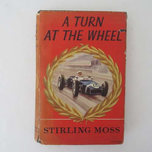 A turn at the wheel by Stirling Moss - Signed by Stirling Moss