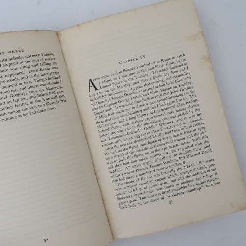 A turn at the wheel by Stirling Moss - Signed by Stirling Moss