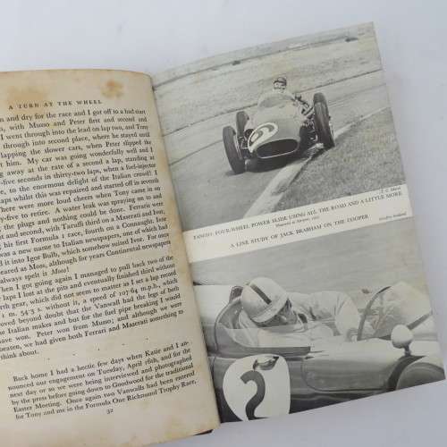 A turn at the wheel by Stirling Moss - Signed by Stirling Moss
