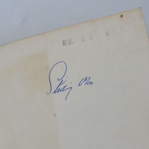 A turn at the wheel by Stirling Moss - Signed by Stirling Moss