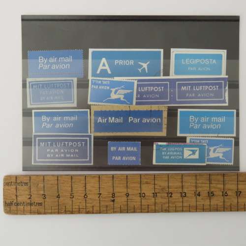 Lot of 14 airmail and priority stickers/stamps