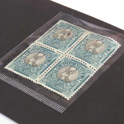 SACC 113 error stamp white mark to left springbok - Top left Afrikaans stamp