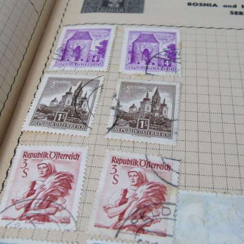 Old stamp album with over 300 stamps - some loose