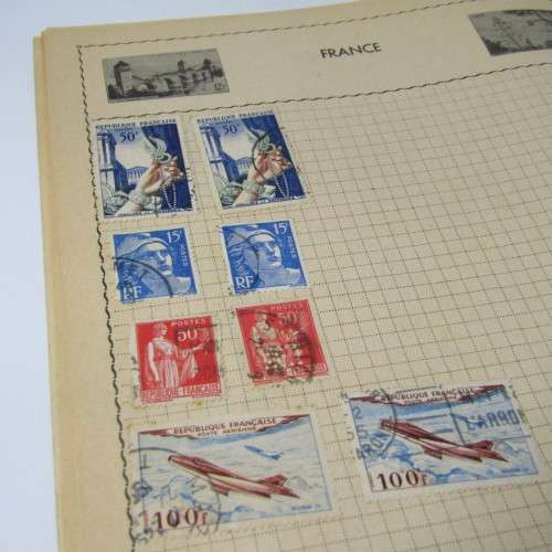 Old stamp album with over 300 stamps - some loose