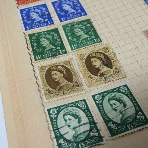 Old stamp album with over 300 stamps - some loose