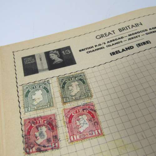 Old stamp album with over 300 stamps - some loose