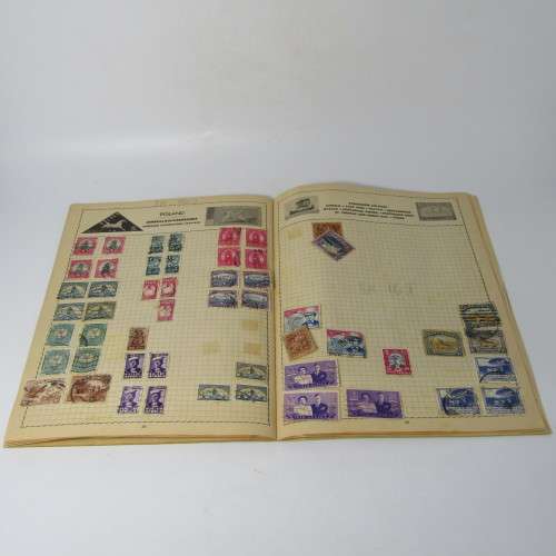 Old stamp album with over 300 stamps - some loose