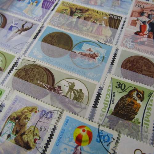 12 Page stamp album with over 500 world stamps