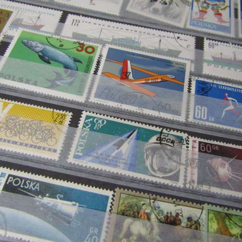 12 Page stamp album with over 500 world stamps