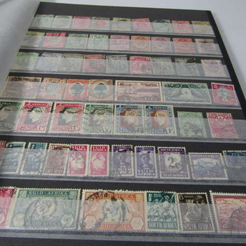 12 Page stamp album with over 500 world stamps