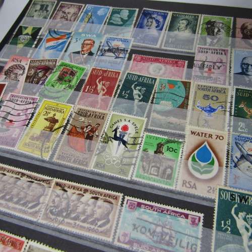 12 Page stamp album with over 500 world stamps