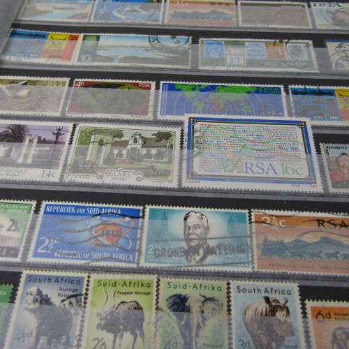 12 Page stamp album with over 500 world stamps
