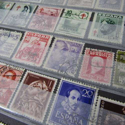 12 Page stamp album with over 500 world stamps