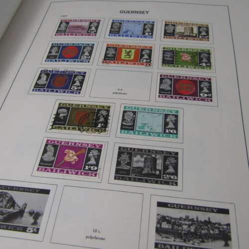 Guernsey and Jersey stamp album with hundreds of old stamps