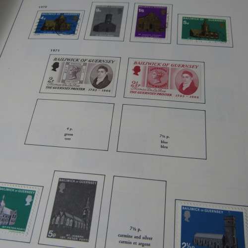 Guernsey and Jersey stamp album with hundreds of old stamps