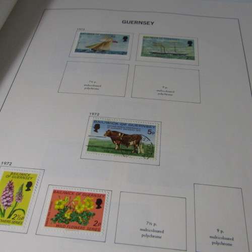 Guernsey and Jersey stamp album with hundreds of old stamps