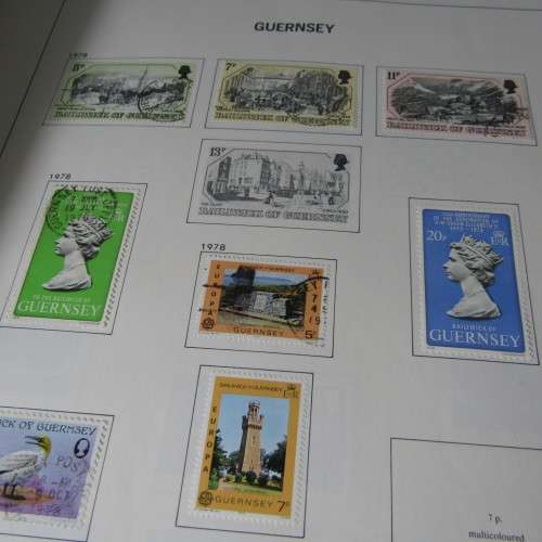 Guernsey and Jersey stamp album with hundreds of old stamps