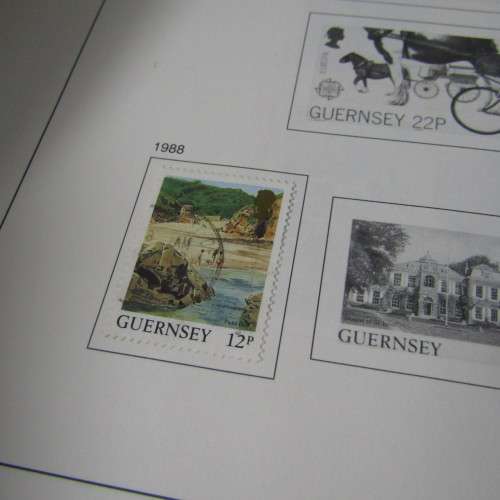 Guernsey and Jersey stamp album with hundreds of old stamps