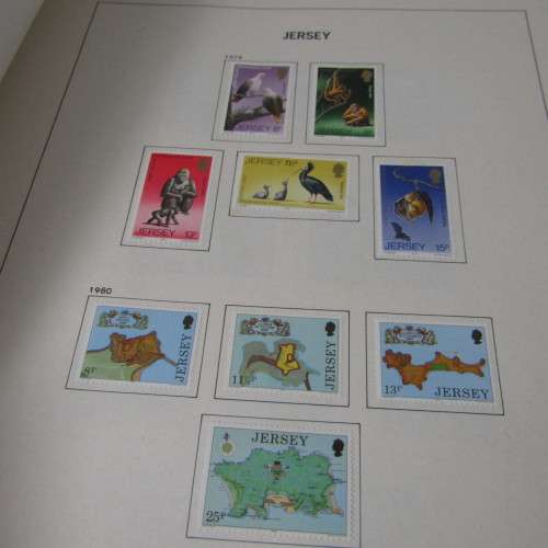 Guernsey and Jersey stamp album with hundreds of old stamps