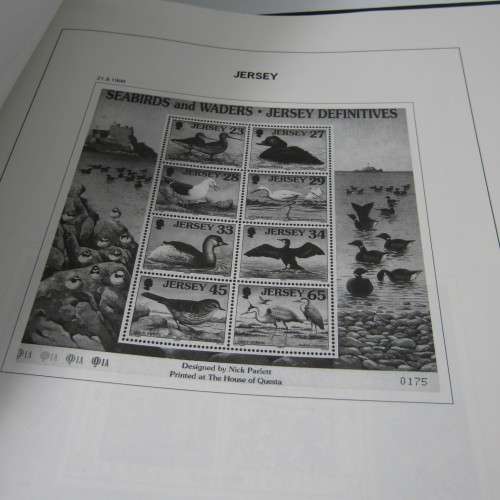 Guernsey and Jersey stamp album with hundreds of old stamps