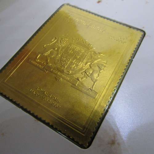 The Royal coats of arms of the Kings and Queens of England 22kt Gold stamps in ledger