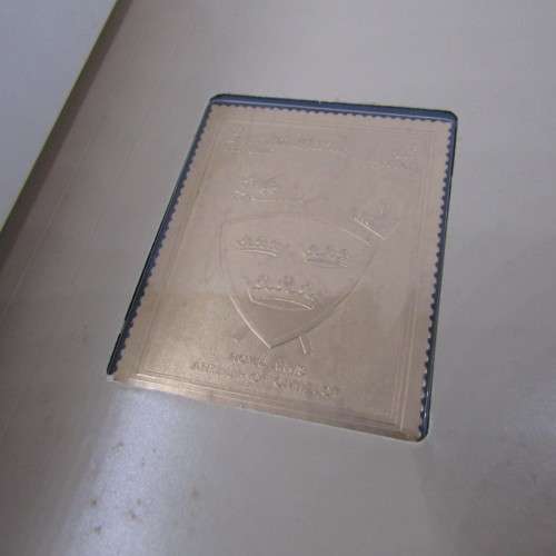 The Royal coats of arms of the Kings and Queens of England 22kt Gold stamps in ledger