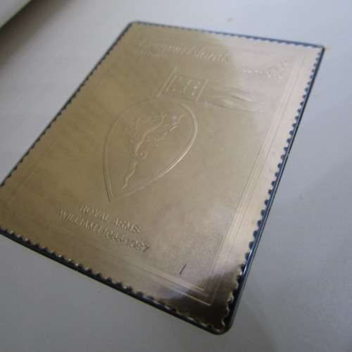 The Royal coats of arms of the Kings and Queens of England 22kt Gold stamps in ledger