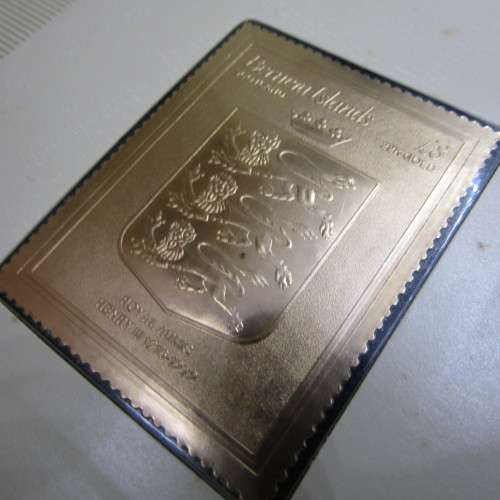 The Royal coats of arms of the Kings and Queens of England 22kt Gold stamps in ledger