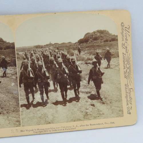 Boer War stereoscope card #25 - Her Majesty`s Heroes marching into Colesberg after the Boers retreat