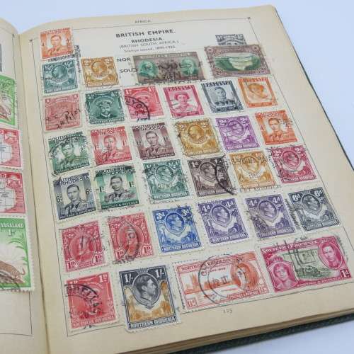 Postal stamp album of the world with over 1300 old stamps - Given to `Alice` in 1937