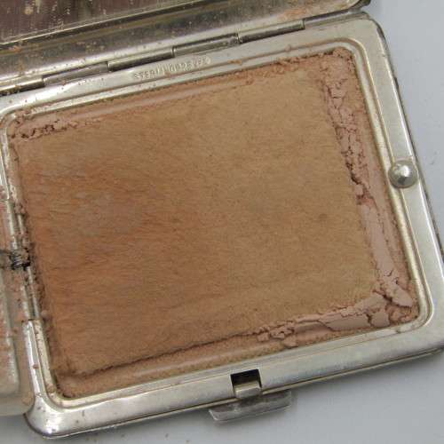 Sterling Silver powder puff with powder