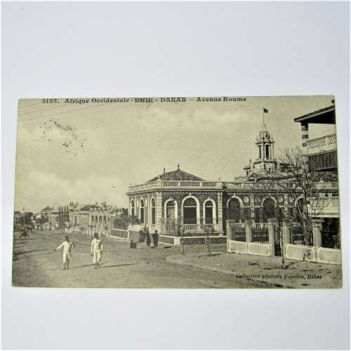 Senegal postcard to England with a Senegal stamp and two unclear cancellations