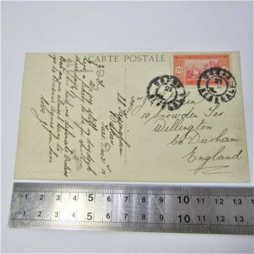 Senegal postcard to England with a Senegal stamp and two unclear cancellations