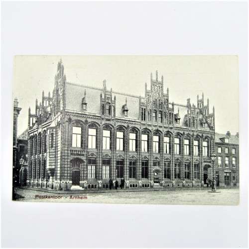 Picture post card of the Arnhem post office in Nederland with two Nederland stamps
