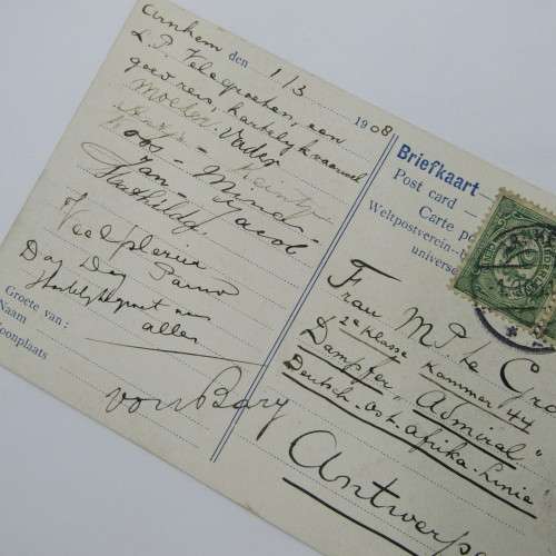 Picture post card of the Arnhem post office in Nederland with two Nederland stamps