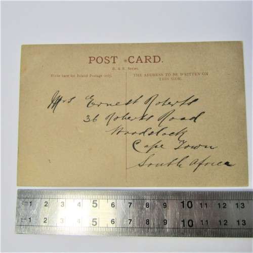 Unused Isle of man post card with picture of street scene with people
