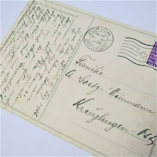 Postally used card from Switzerland young boy watering flowers post card