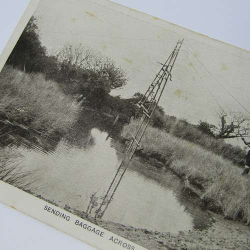 Boy Scouts postcard showing how they send baggage across the river - unused