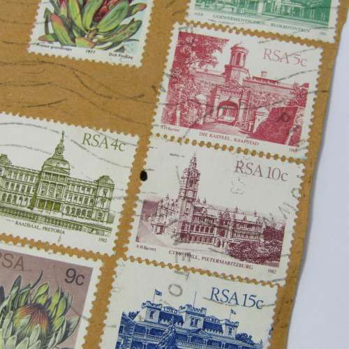Lot of South African building stamps and others on piece with airmail