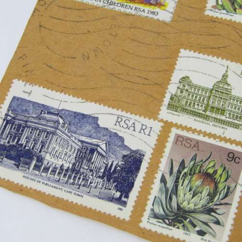 Lot of South African building stamps and others on piece with airmail