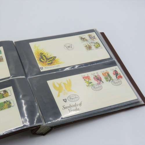 First day cover album with 72 pages and 27 covers and other items - Venda