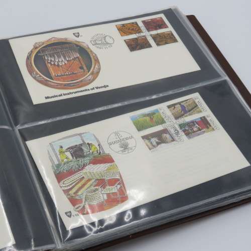 First day cover album with 72 pages and 27 covers and other items - Venda