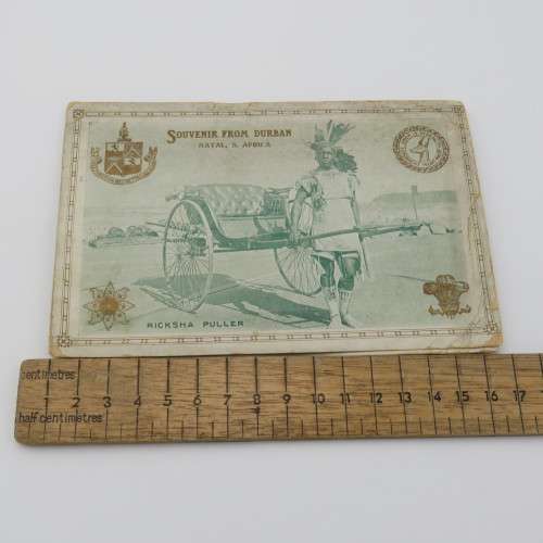 Antique souvenir card from Durban with Ricksha Puller, Grey street, street view and silver leaves